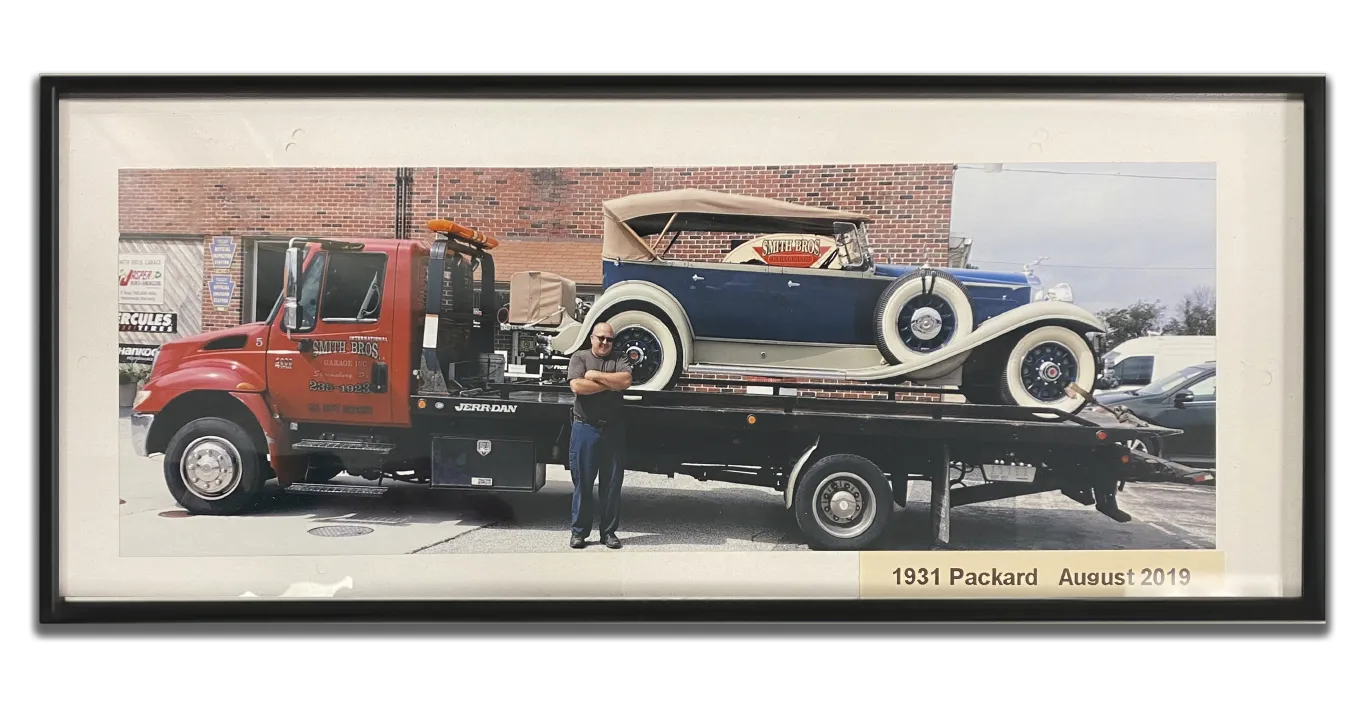Smith Bros Garage Packard transported on rollback